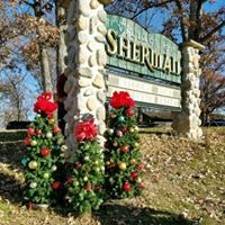 Sherman sign with some small christmas trees