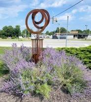 sculpture surrounded by plants