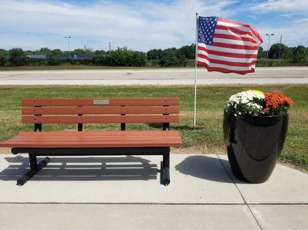 bench with us flag and planter